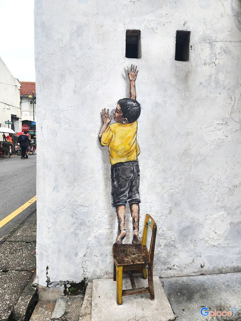 Penang Street Art   Boy on Chair by Ernest Zacharevic