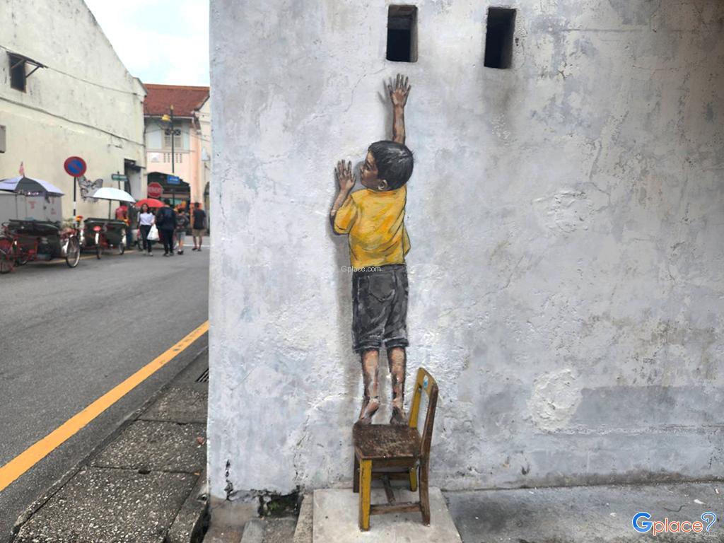 Penang Street Art   Boy on Chair by Ernest Zacharevic